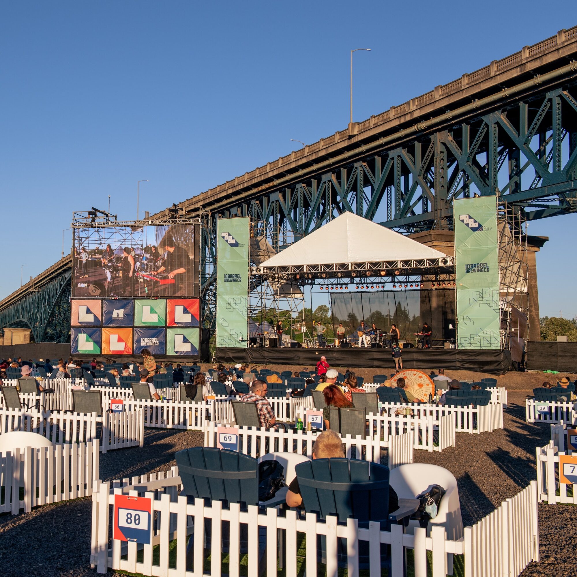 Concertgoers enjoy live music at the Lot at Zidell Yards on Portland's waterfront.